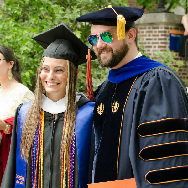 Shannon Brobst '15 at Commencement with Econ. Prof. Rim Baltaduonis
